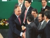 Salvadoran President Alfredo Cristiani (L) shakes hands with Salvadoran guerrilla leaders (from left to right): Schafik Handal, Joaquin Villalobos, Salvador Sanchez and Francisco Jovel after the signing of a peace accord at the Chapultepec Castle in Mexico City 16 January 1992. The treaty ends 12 years of civil war.